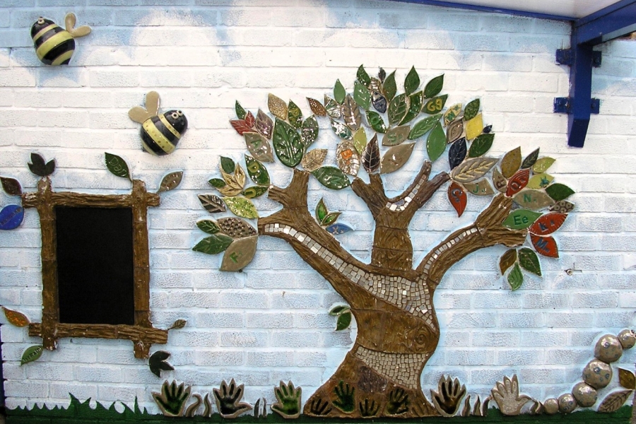 Mural for Oldfield Brow Primary, designed by the pupils. Stoneware ceramic and mirrors.